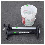 Bucket and two bicycle pumps