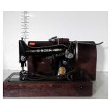 Singer Sewing machine portable type with case.