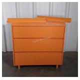 Orange painted three drawer chest with matching