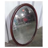 Mahogany oval framed beveled glass mirror,
