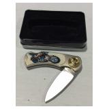 Pocket knife with Indian motorcycle design in tin