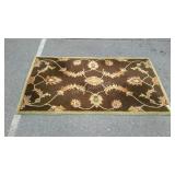 Shapes brand brown and green hand-tufted wool rug