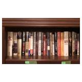 Five shelves of books. Novels, autobiographies,