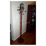 Coat rack. Does come apart. 68" high.