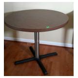 Restaurant style table. 34"round × 29" high.
