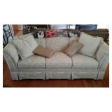 Broyhill three cushion upholstered sofa. Includes