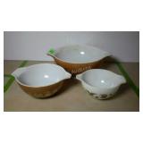 Three nesting Pyrex bowls. Missing the second