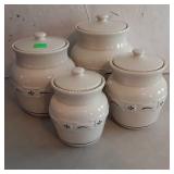 Longaberger pottery canister set, four canisters