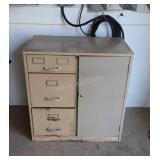 Metal three drawer filing cabinet with safe built