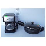 Mr. coffee maker and three skillets