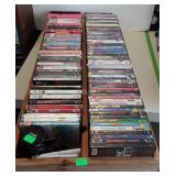 Wooden box full of DVDs and comes with I home