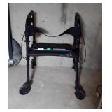 Invacare Walker with seat, four full size wheels,
