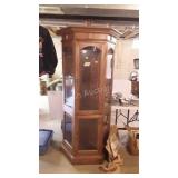 Curio cabinet with glass shelves still wrapped up