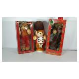 Three animated plush Christmas teddy bears, two