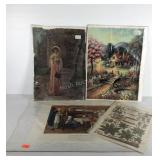 Unframed art prints and book page, range in size