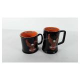 Two Harley-Davidson mugs, one made in Thailand,