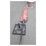 Wrought iron umbrella stand with umbrella