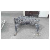 Metal park bench missing a leg