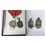 Four award charms Iowa High School Athletics,