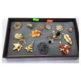 Display with brooches and jewelry