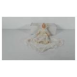 Porcelain doll with blanket and box, 9"