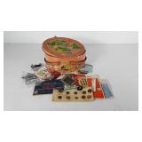 Sewing buttons and notions in tin with lid and