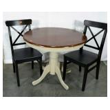 Dining table and two chairs, table could use a