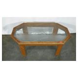 Coffee table with etched glass top featuring