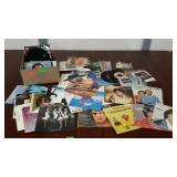 Box of assorted 45 RPM records. Madonna, American