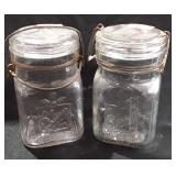 Two queen wide mouth Mason jars with glass lids,