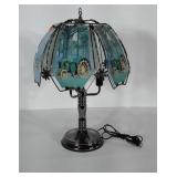 Lamp with glass paneled shade. Panels have