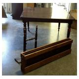 Dining table with two leaves and storage crate.