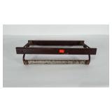 Paper roll dispenser. Measures 22" long and 12"