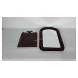 Mirror with wooden frame and metal hanging frame.