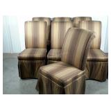 Seven upholstered and skirted chairs, may need