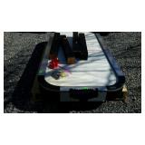 Halex electric air hockey table with accessories.