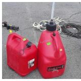 Two Red Poly Gasoline Containers