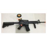 Smith and Wesson M&P15 BB gun with open jar of