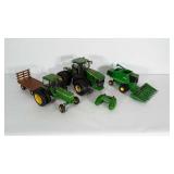 John Deere toy lot. The largest piece is plastic