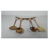 Brass wall hanger with four brass cooking