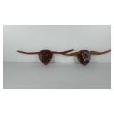 Two wooden Longhorn steer wall decor pieces, both