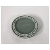 Wedgwood green dip trivet with three ball feet,