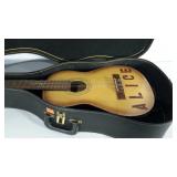 Encore guitar with strap and case, wear as shown