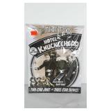 Three Stooges metal sign still in plastic.