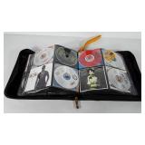 CD case full of CDs, includes Randy Travis,