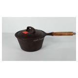 Cast iron 2qt sauce pan with lid and wooden