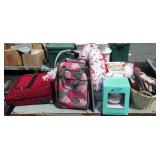 Skid lot  with suitcases, feathers, baby seat,