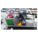 Skid of fan, watering cans, fuel cans, suitcase,