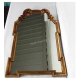 Mirror with uniquely shaped frame. At tallest /