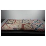 Textiles, two baby quilts, one shows wear, both